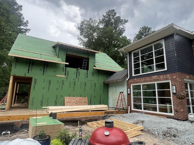 A house under construction with the framing exposed