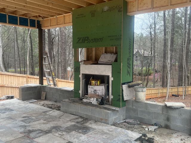 A house under construction with the framing exposed