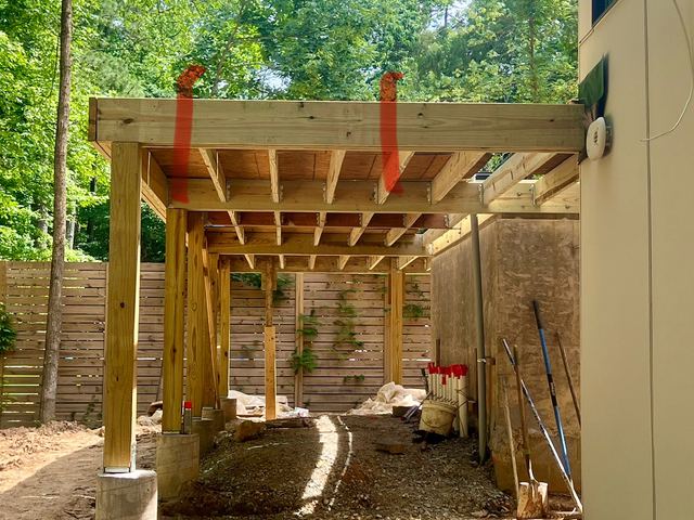A house under construction with the framing exposed