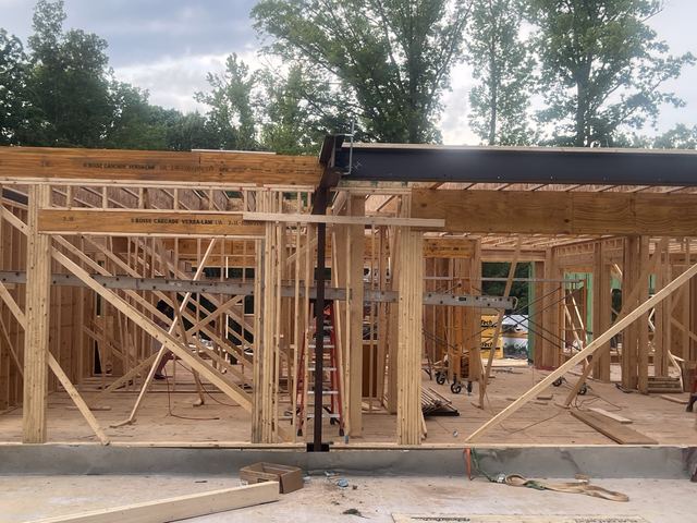 A house under construction with the framing exposed