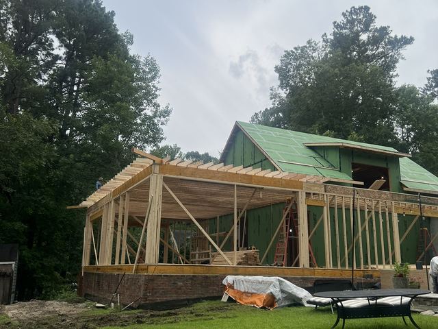 A house under construction with the framing exposed