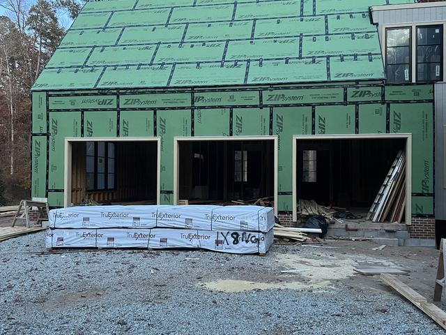 A house under construction with the framing exposed