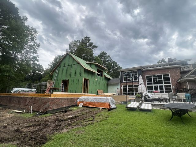 A house under construction with the framing exposed